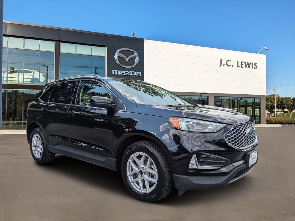 2024 Ford Edge SEL in Agate Black Metallic — front three-quarter view