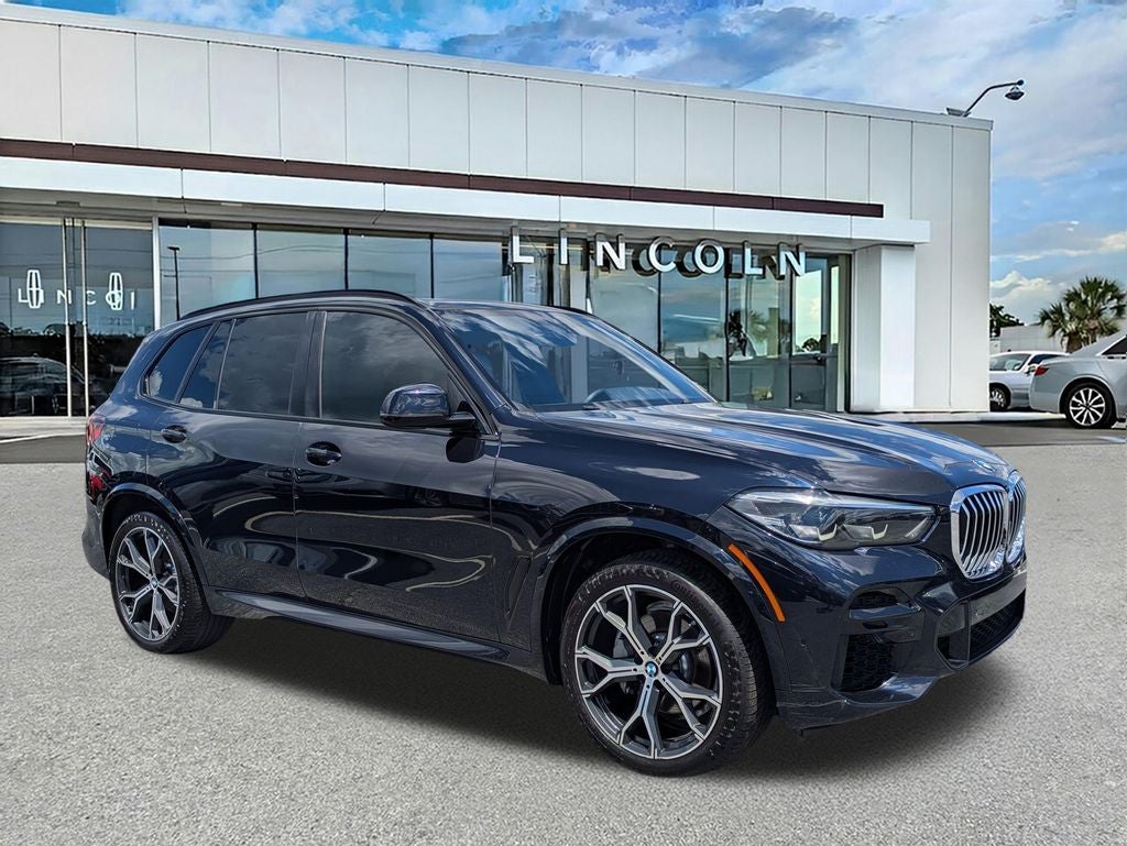 2023 BMW X5 sDrive40i in Carbon Black Metallic — front three-quarter view